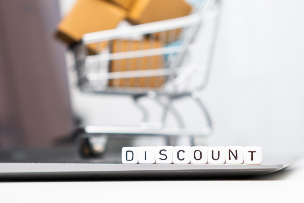 discount word on cubes with a toy shopping cart an 2025 03 07 23 07 14 utc
