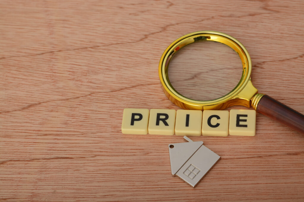 magnifying glass and house model with text price 2025 03 10 12 25 40 utc