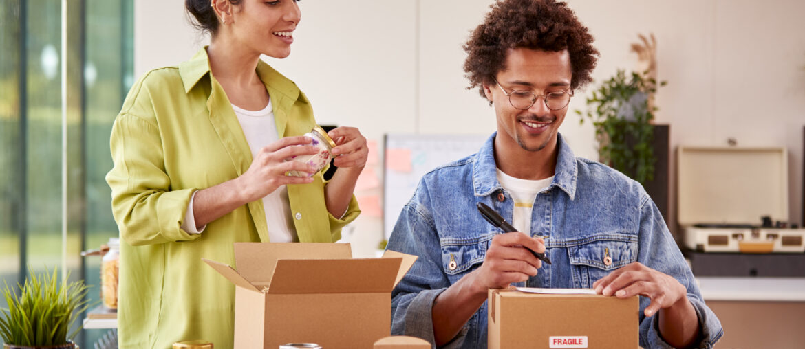 couple running online business from home packing a 2024 10 19 04 58 13 utc