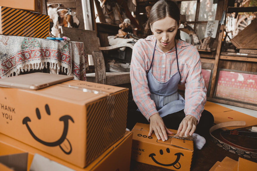 woman packing products order box send to customer 2025 03 05 04 33 10 utc