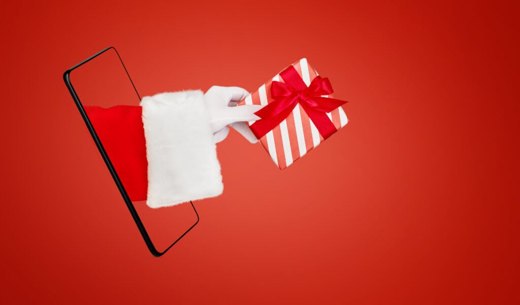 Yılbaşı’nın İthalat-İhracata Etkisi 4 christmas santa claus hand holding or gives red gi 2025 12 07 18 27 55 utc 1