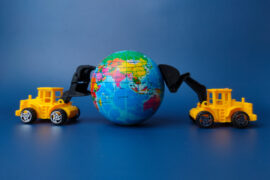 excavator pushing earth globe on blue background 2024 12 07 23 55 23 utc