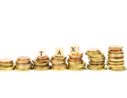 stacked change with word tax on a white background 2025 02 02 20 17 14 utc